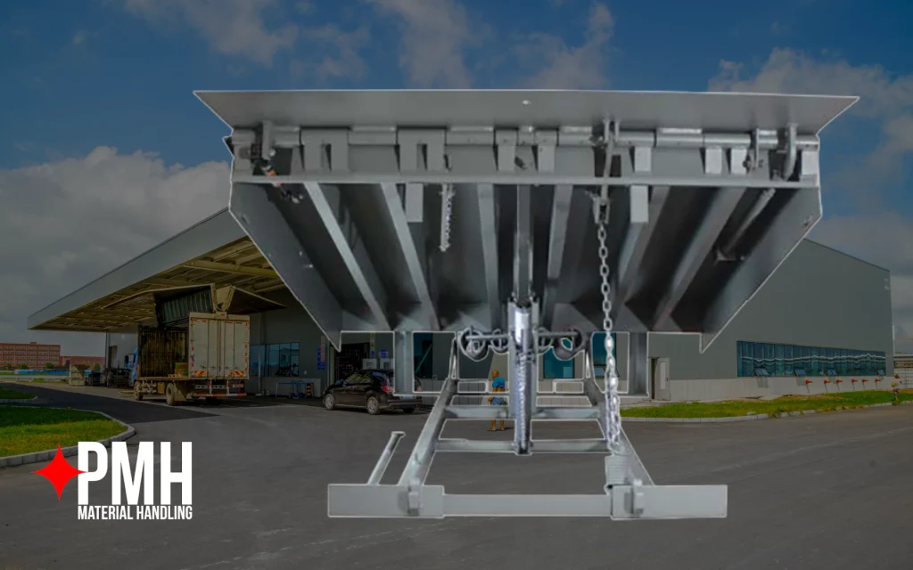 Heavy-duty mechanical dock leveler positioned in front of a commercial loading dock facility, designed to create a safe bridge between warehouse docks and delivery trucks for efficient loading and unloading.